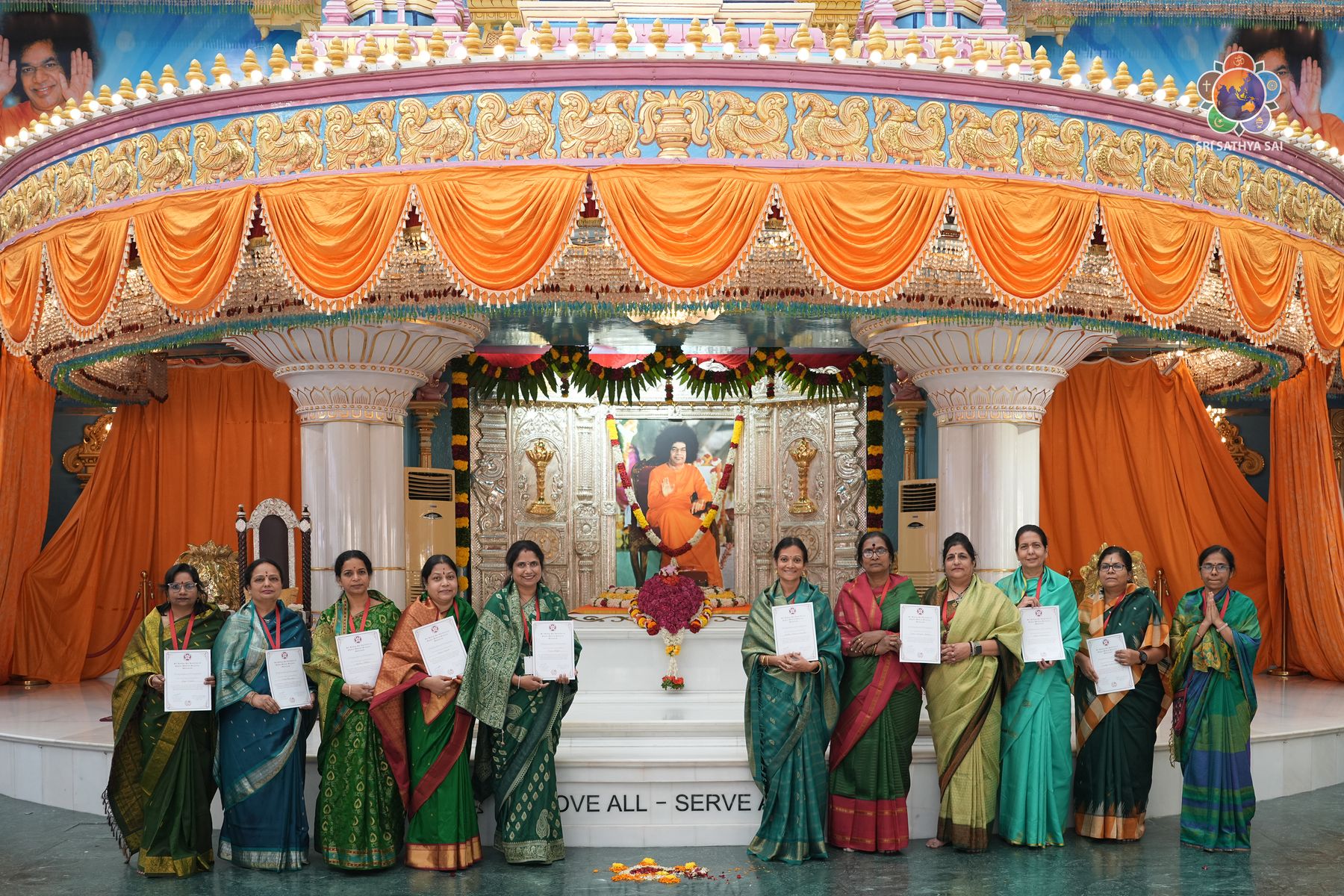 Staff with certificates at Sai Kulwant Hall