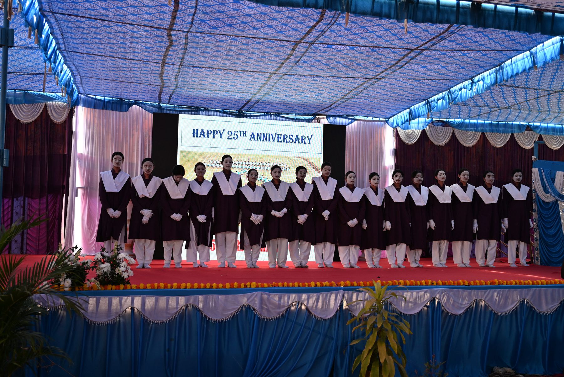 Students singing on stage