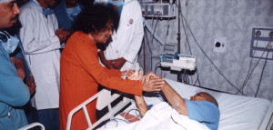 Swami blessing another patient