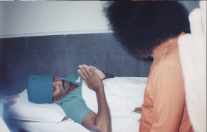 Swami blessing a patient going to surgery