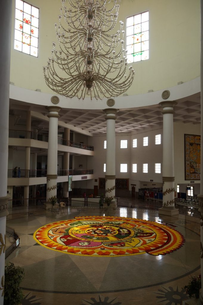 The Murano chandelier in the hospital dome, above the Onam floral carpet in the atrium