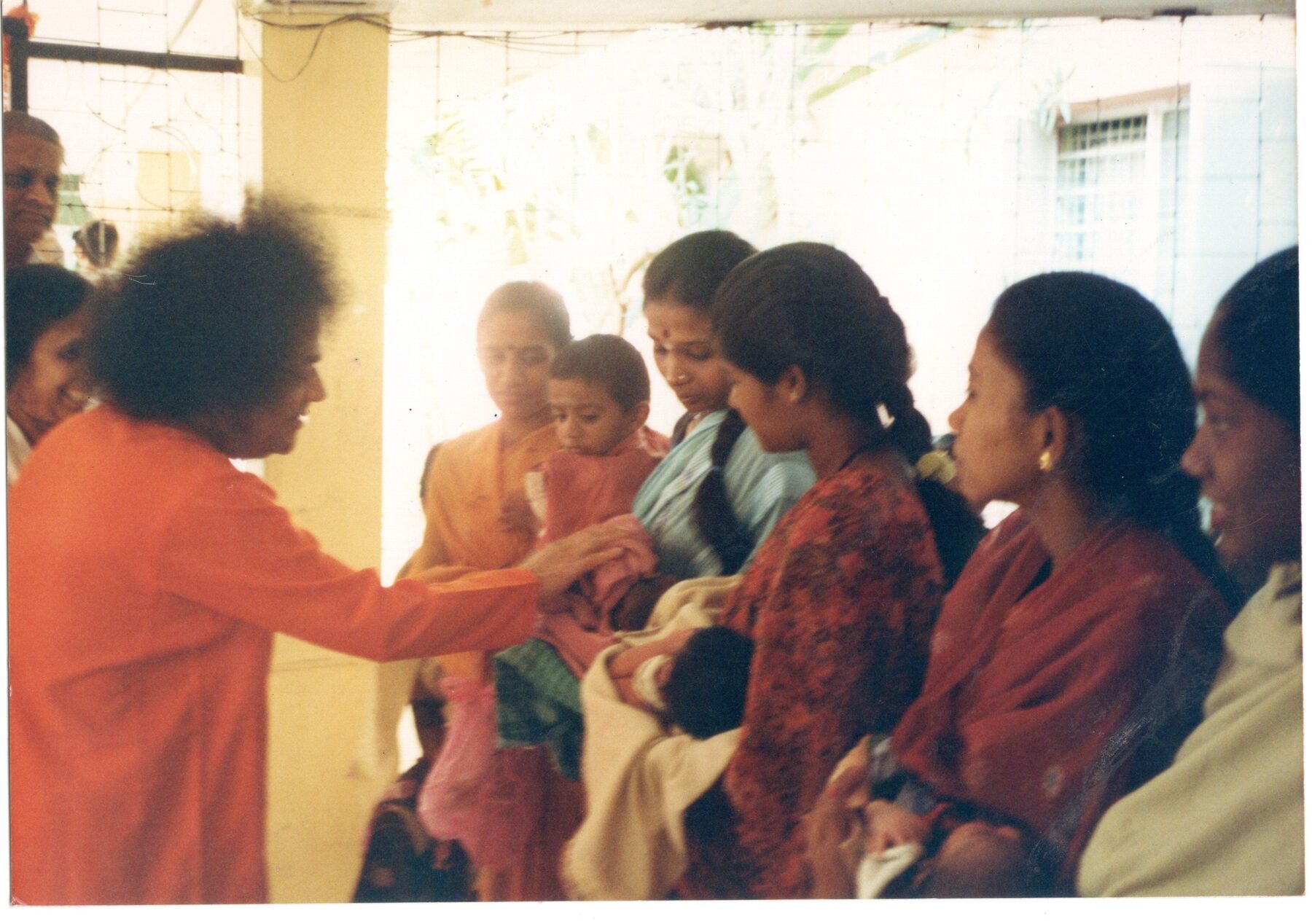 Bhagawan with newborns and their mothers