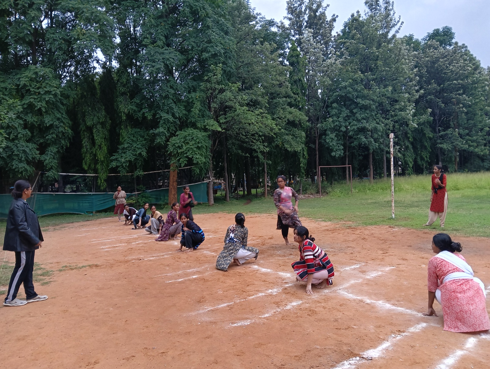 Nursing students playing kho kho on the sports ground