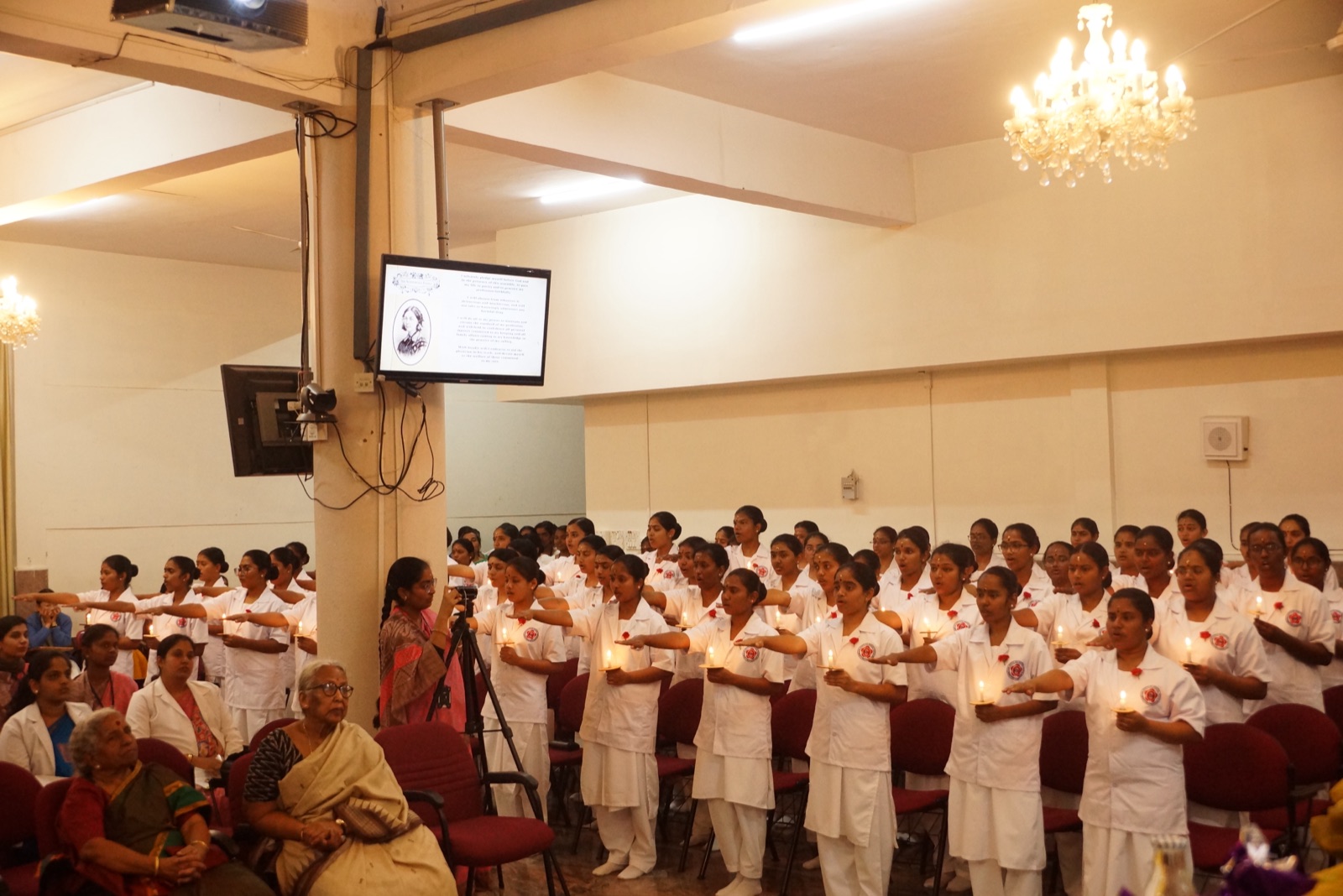 Nursing students holding lamps at the lamp-lighting ceremony, 2025