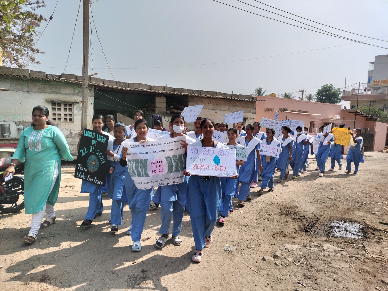 Nursing students carrying placards on a World Water Day awareness rally