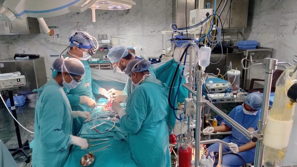 Surgeons and a perfusionist during open-heart surgery