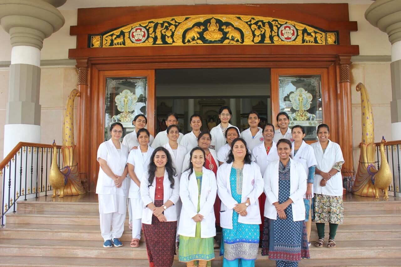 Doctors and nurses of the Obstetrics and Gynaecology department at the hospital entrance